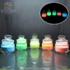 Glow powder colour examples in glass jars with a dark-view inset