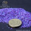 Multi Amethyst crushed opal chips beside a coin for scale