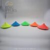Five coloured glow powders arranged in a row in daylight