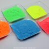 Coloured glow powders in clear trays