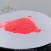 Neon pink glow powder in daylight