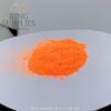 Neon orange glow powder in daylight