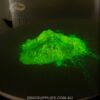 Neon yellow powder glowing in the dark