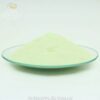 Yellow green glow powder in daylight