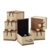Burlap-covered ring boxes shown open and closed