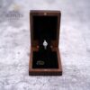 Open walnut ring box with a raised ring stand