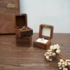 Walnut ring boxes with brown and white cushions