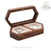 Open walnut ring box with a viewing window and two white ring cushions