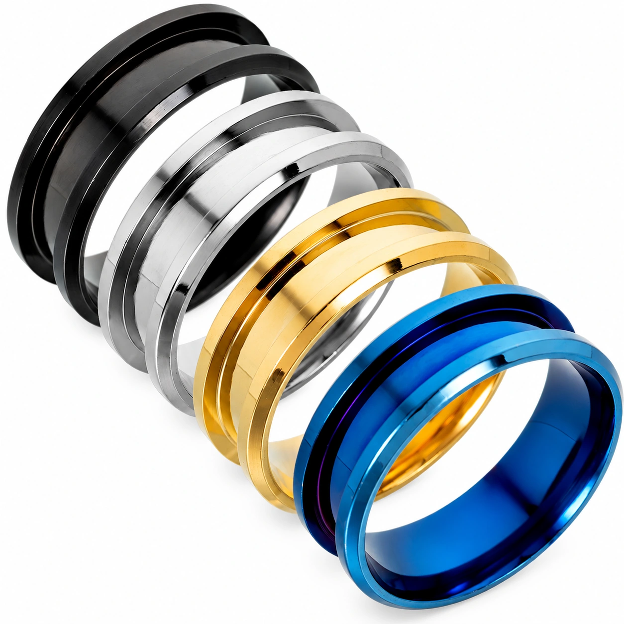 Black, silver, gold and blue stainless steel ring blanks with inlay channels on a white background
